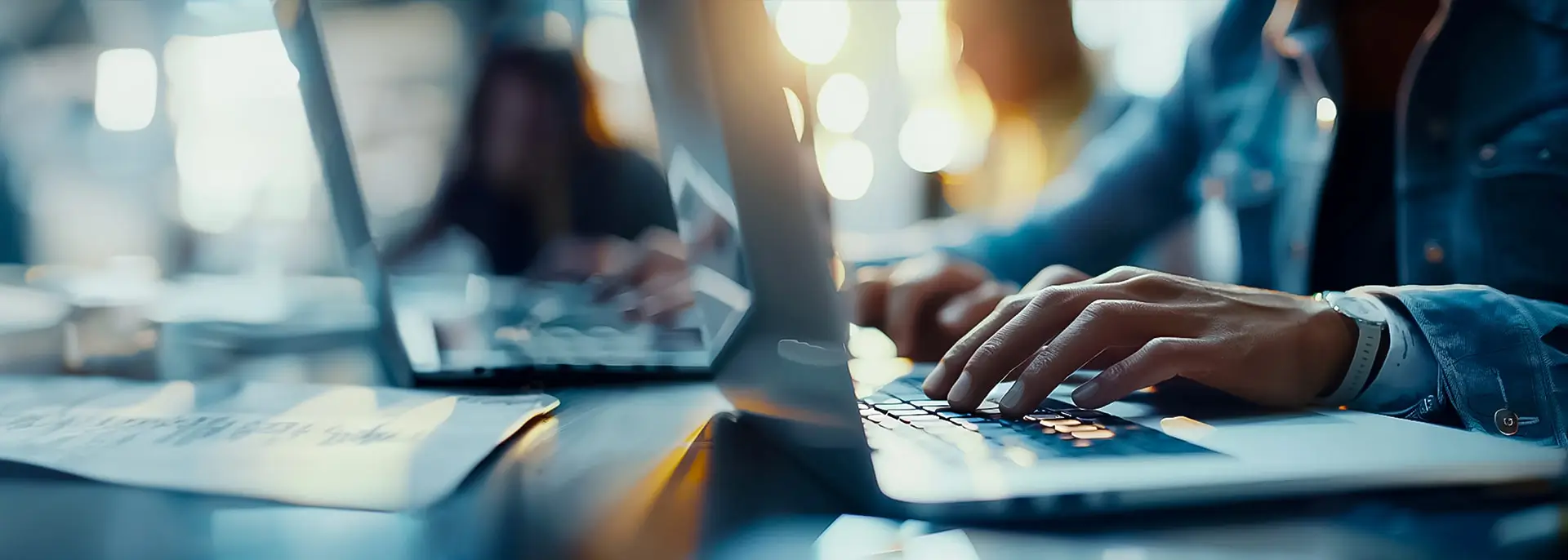 Marketing professionals working on laptops