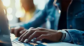 Marketing professionals working on laptops