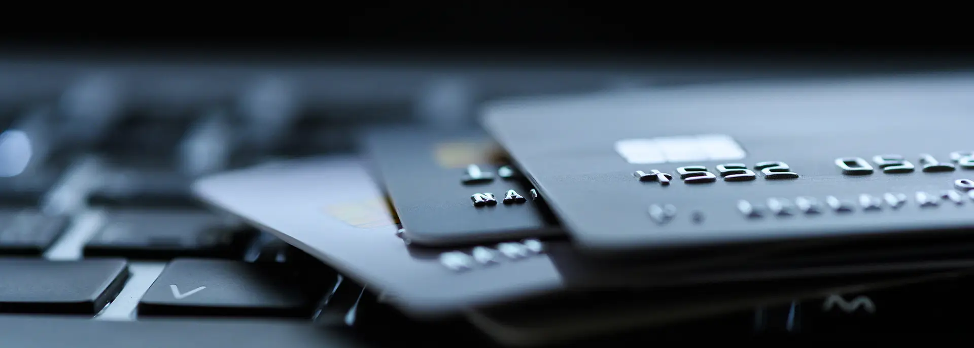 Close up of credit cards on a laptop computer