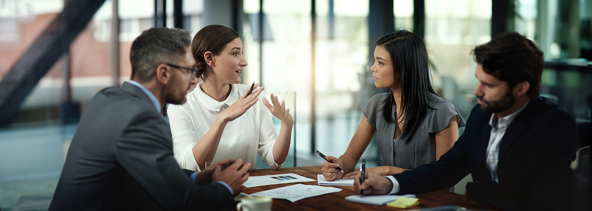 Business people at a table looking at documents