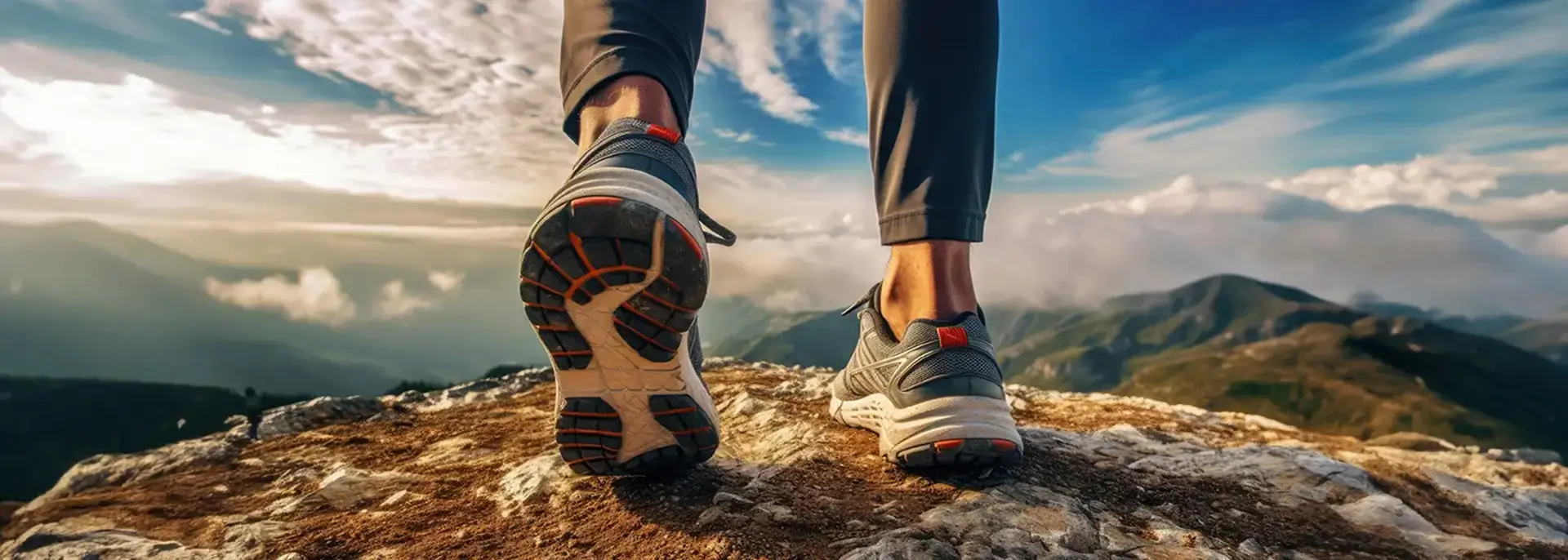 Hiker foots shoes over landscape background